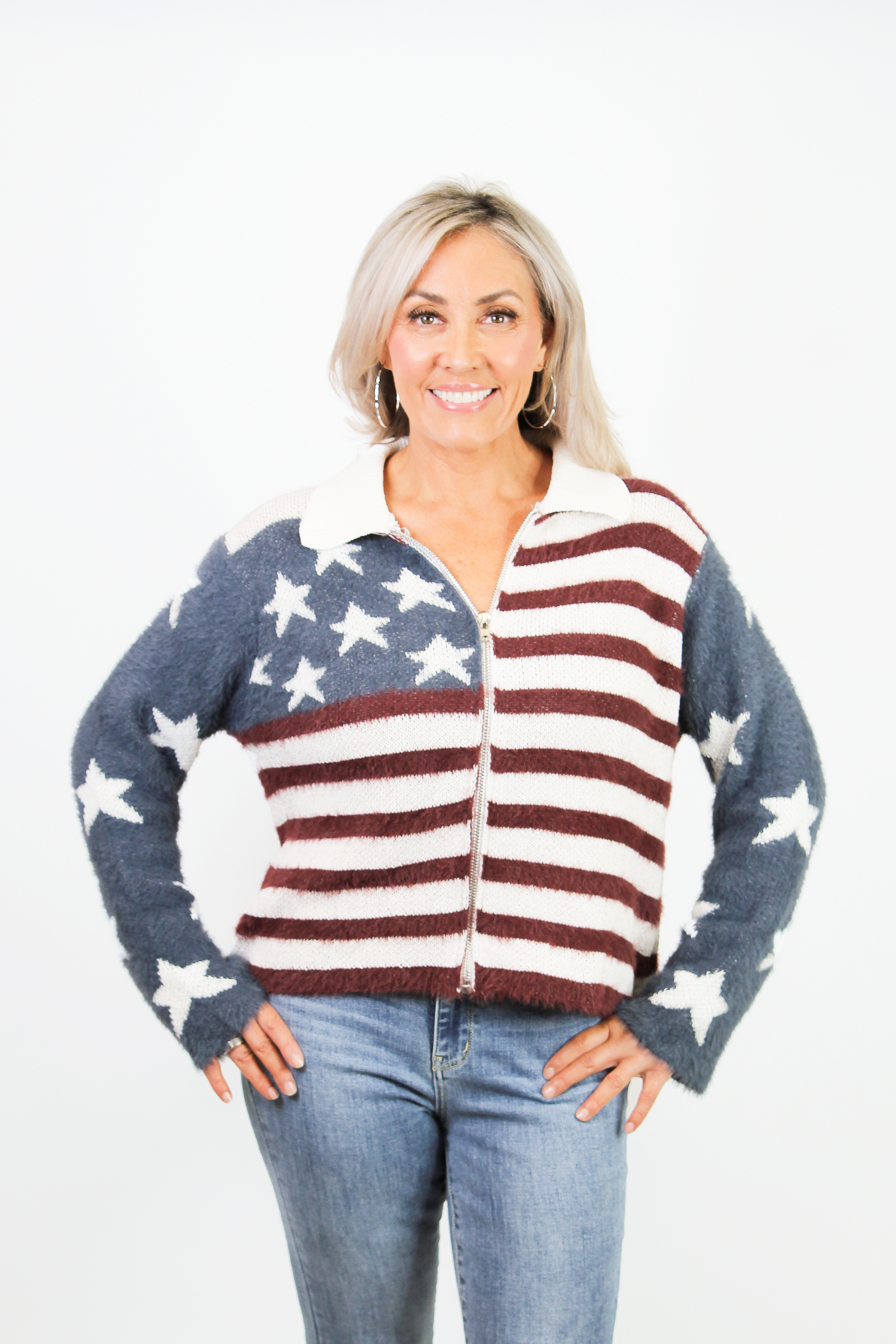 Woman wearing a cardigan with an American flag pattern on a white background