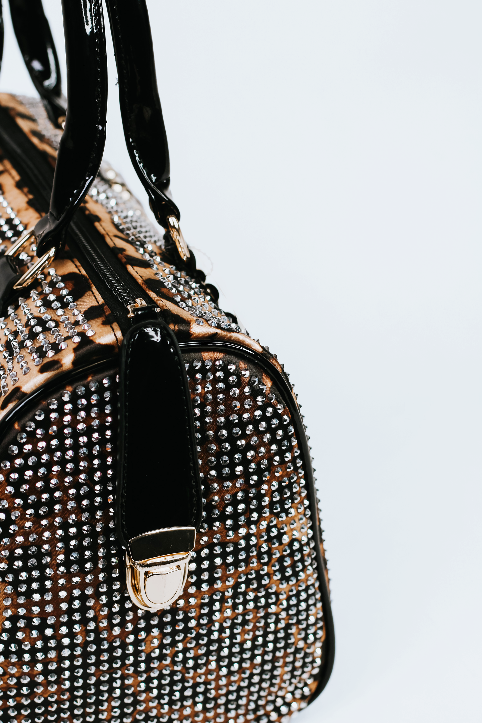 All Over Rhinestone Duffle Purse w/ Faux Patent Leather Accents