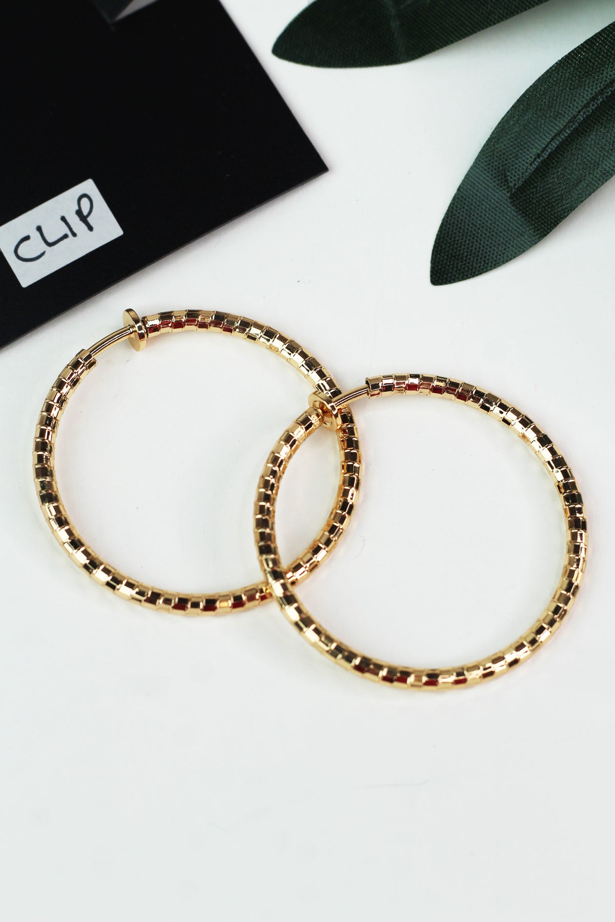 Medium Textured Metal Clip On Hoop Earrings