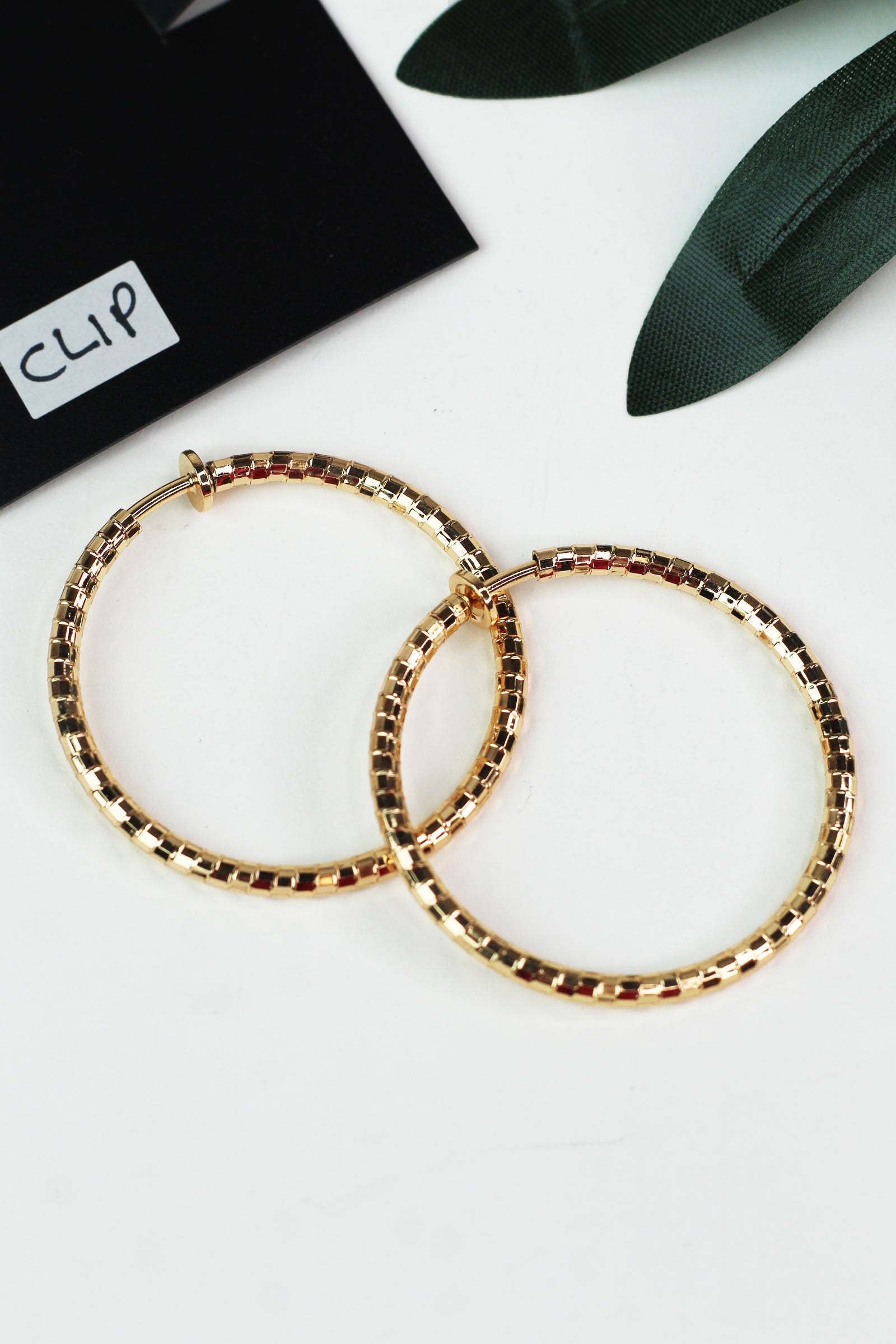 Medium Textured Metal Clip On Hoop Earrings