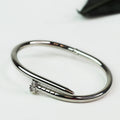 Metal Nail Bangle w/ Rhinestone Tip