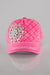 A front facing view of a bright pink quilted baseball cap with a large rhinestone flower embellished on the front and white stitching detail throughout.