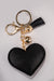 A front view of a black and silver puffy heart keychain with rhinestone embellishment and gold hardware.