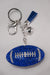 A royal blue rhinestone football keychain with matching royal blue tassel and silver hardware. 