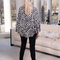 Zebra Print Tied Sleeve Top
