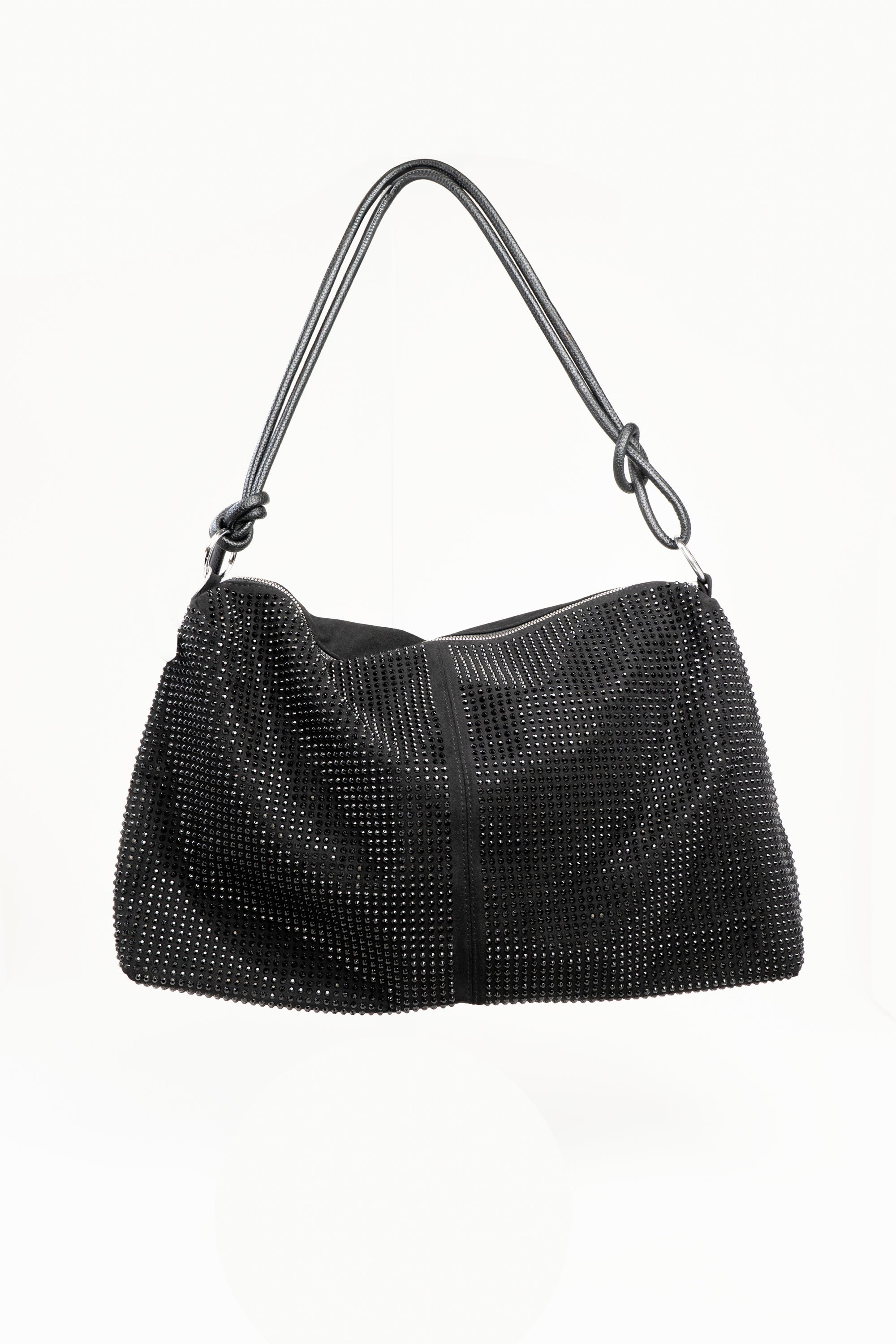 A front view of a large black rhinestone embellished handbag with a leather cord strap. This bag also features silver hardware and a long silver zipper on top. This view has the strap suspended above the bag, to show how it looks while being carried.