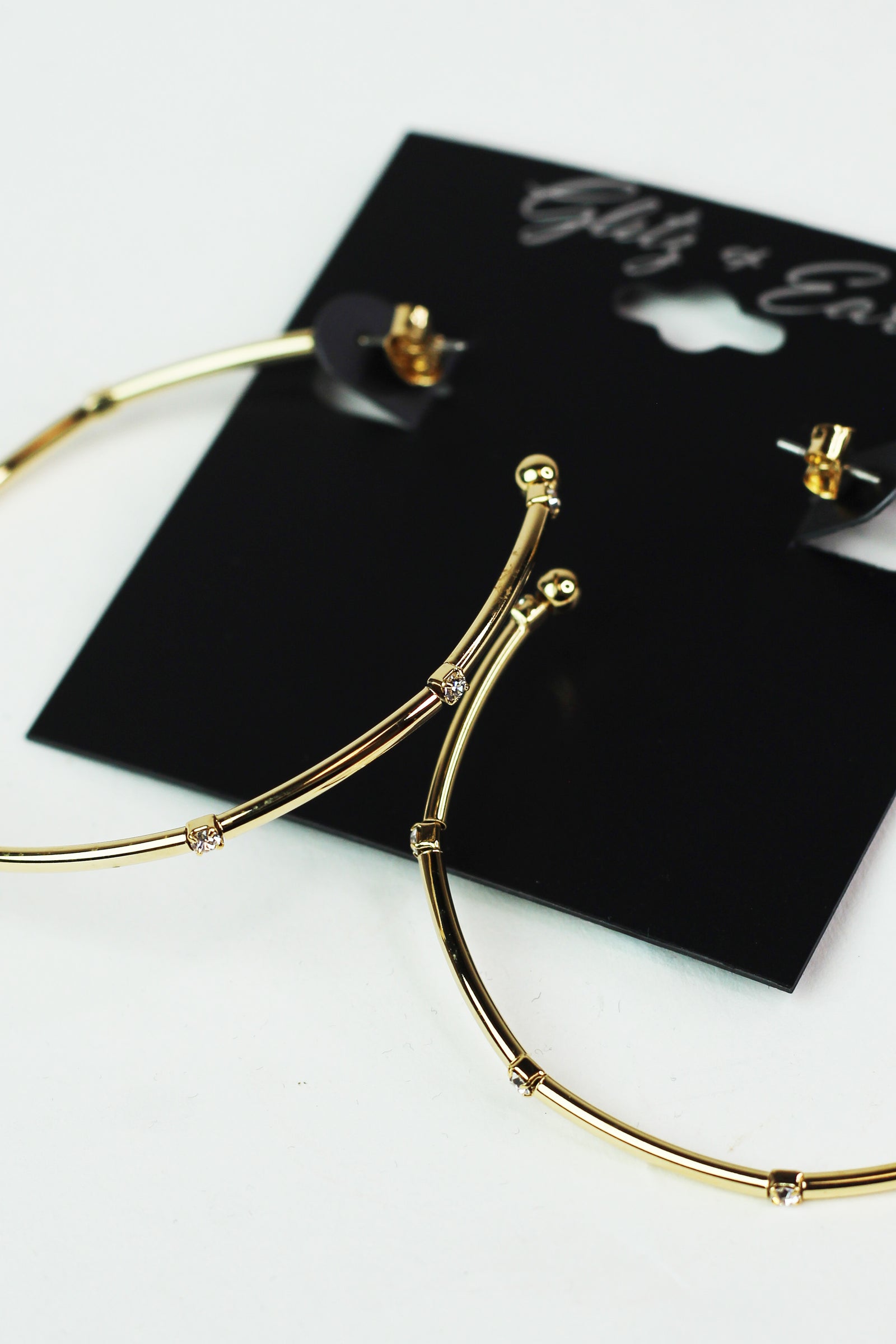 Metal Row Spaced Stone Alternate Medium Hoop