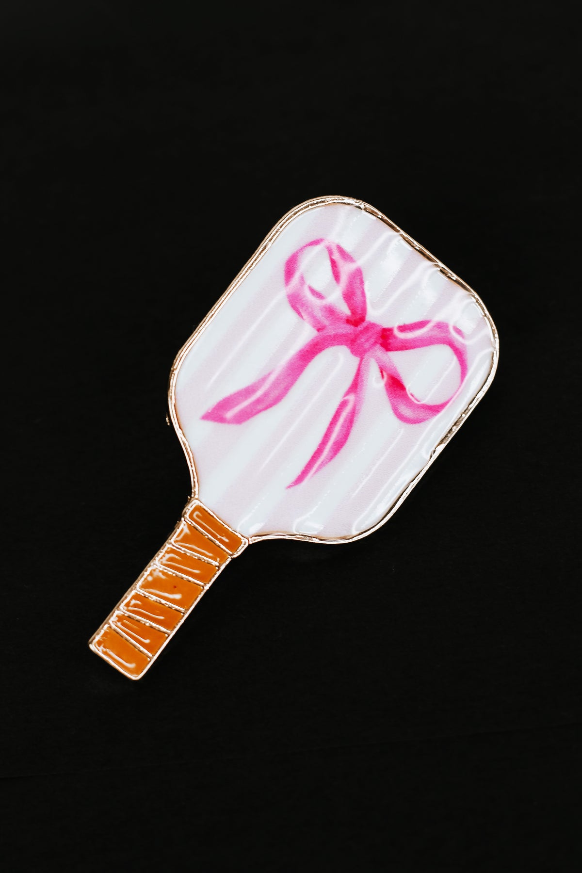 Paddle with Bow Brooch