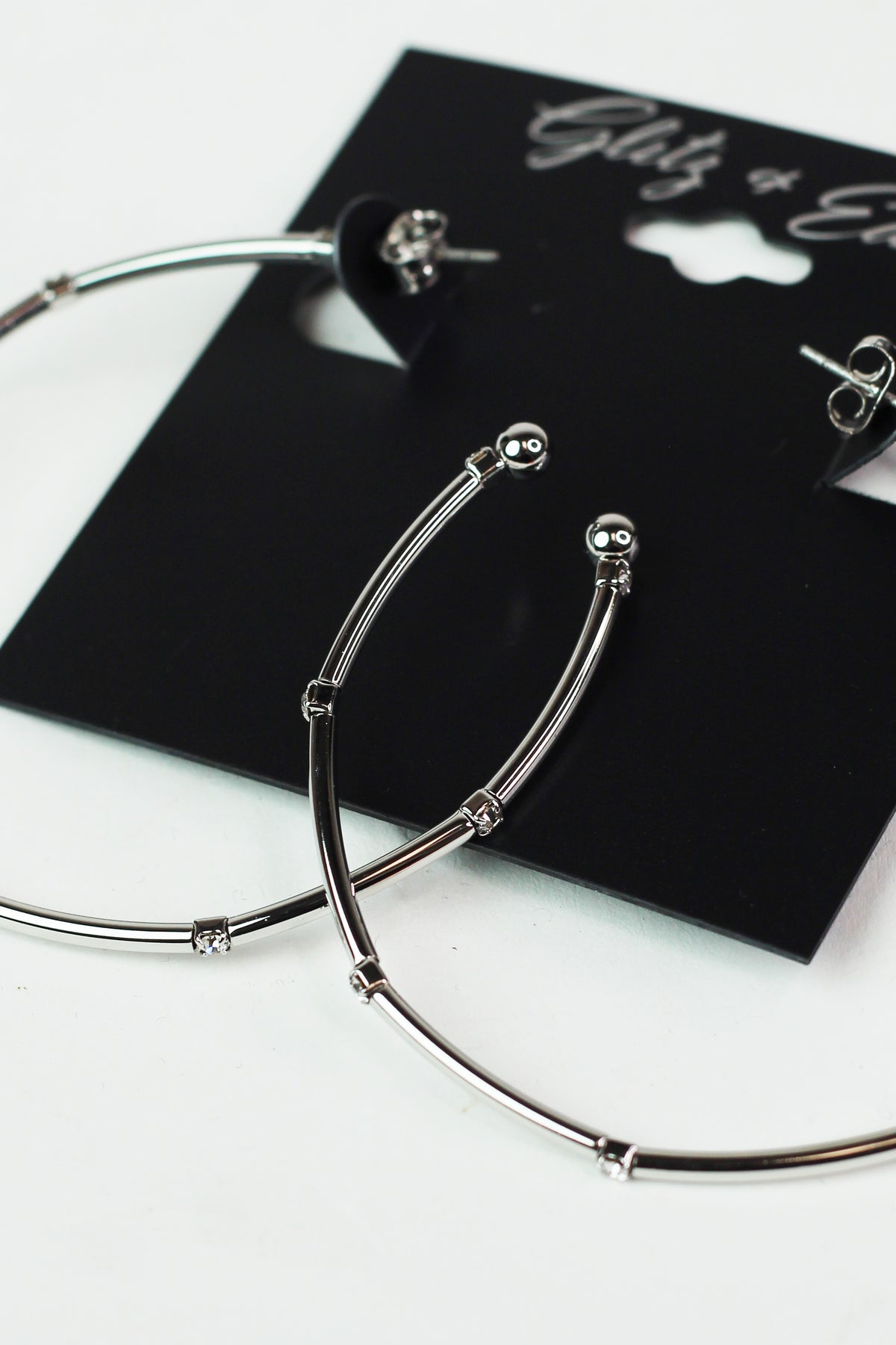 Metal Row Spaced Stone Alternate Medium Hoop